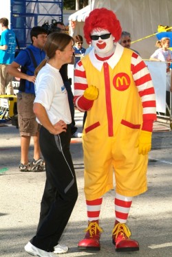 Uta and sponsor Ronald McDonald discuss running shoes. © Take The Magic Step®
