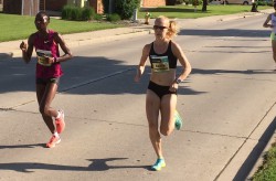 Risper Gesabwa and Kaitlin Gregg Goodman ran side by side on this warm day in Green Bay. © Michael Reger